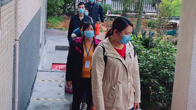 Workers at the Vyaire Medical facility in Shenzhen, China, follow a daily routine before they entering the plant, including temperature checks and hand washing.