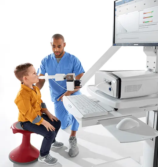 Clinician testing a patient at Vyntus ONE pulmonary function testing system.